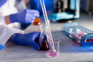 Image showing close up of scientists making test in lab