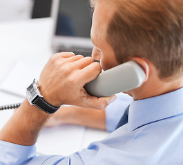 Image showing handsome businessman talking on the phone