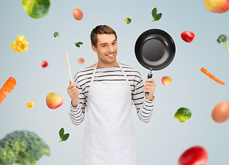 Image showing happy man or cook in apron with pan and spoon