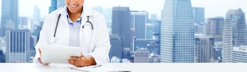 Image showing happy african female doctor with tablet pc