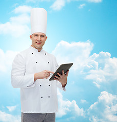 Image showing happy male chef cook holding tablet pc