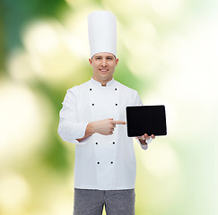 Image showing happy male chef cook showing with tablet pc