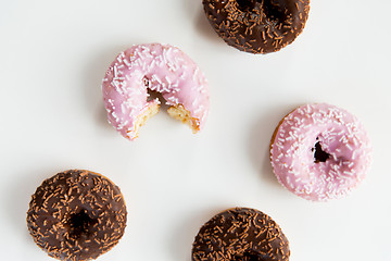 Image showing close up of glazed donuts pile over white