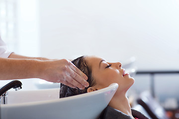 Image showing happy young woman at hair salon