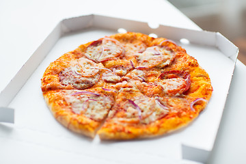 Image showing close up of pizza in paper box on table