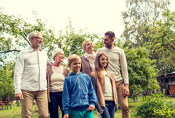 Image showing happy family in front of house outdoors