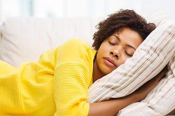 Image showing african young woman sleeping on sofa at home