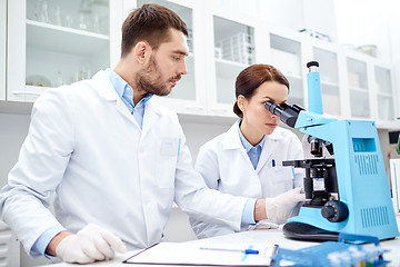 Image showing young scientists making test or research in lab