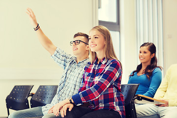 Image showing group of smiling students in lecture hall