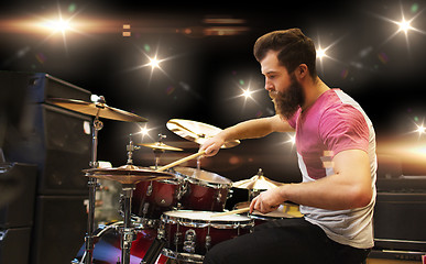 Image showing male musician playing cymbals at music concert