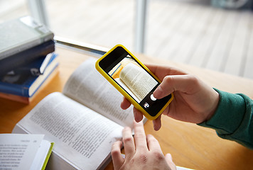 Image showing student hands with smartphone making cheat sheet