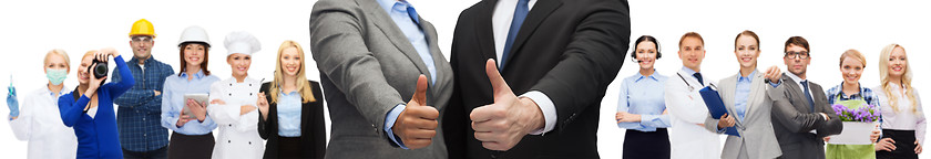 Image showing businessman and businesswoman showing thumbs up