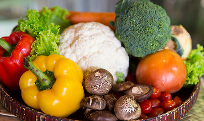 Image showing basket of fresh ripe vegetables at kitchen