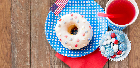 Image showing donut with juice and candies on independence day