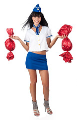 Image showing Young beautiful air hostess with 2 big candies