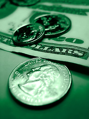 Image showing Coins on twenty dollar bill