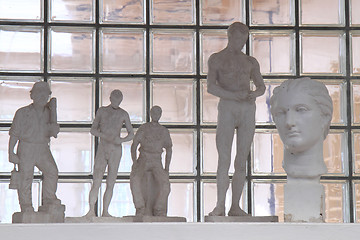 Image showing cast heads and statues