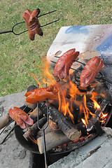 Image showing bratwurst preparing on the fire