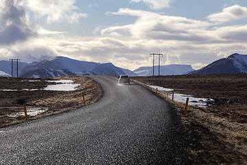 Image showing Snowy volcano landscape with dramatic clouds in Iceland