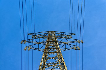 Image showing Large electric pylon with blue sky