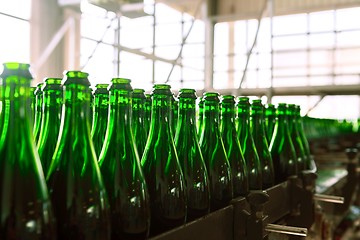 Image showing Many bottles on conveyor belt