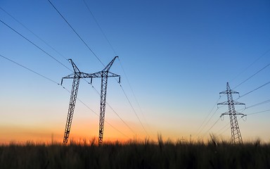 Image showing Large transmission towers at blue hour 