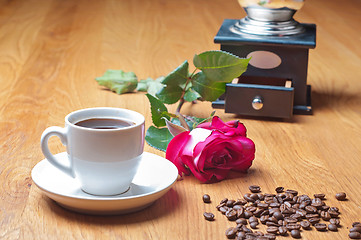 Image showing Vintage coffee mill, cup and rose