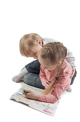 Image showing Little girl and boy painting