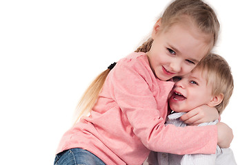 Image showing Brother and sister hugging in studio