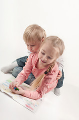 Image showing Little girl and boy painting