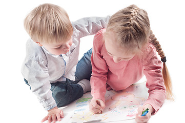 Image showing Little girl and boy painting