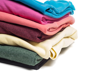 Image showing Closeup of pile of folded T shirts