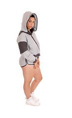 Image showing Standing woman in gray hoodie and shorts.