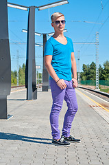 Image showing Stylish man in blue standing on train station
