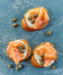 Image showing toasted bread slices with cream cheese and smoked salmon