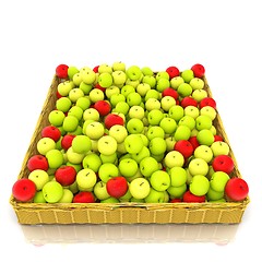 Image showing Wicker basket full of apples isolated on white