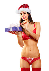 Image showing sexy Santa with presents isolated
