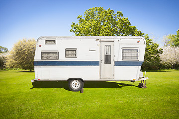 Image showing Classic Old Camper Trailer In Grass Field