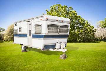 Image showing Classic Old Camper Trailer In Grass Field