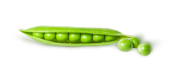 Image showing Opened green pea pod and peas