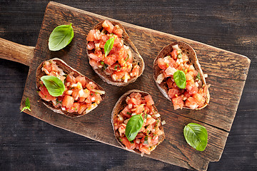 Image showing toasted bread with chopped tomatoes