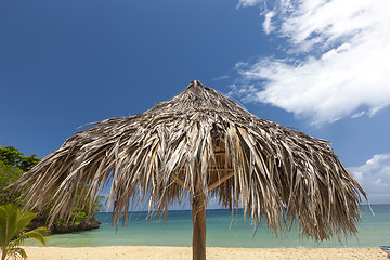 Image showing straw umbrella on a tropical beach