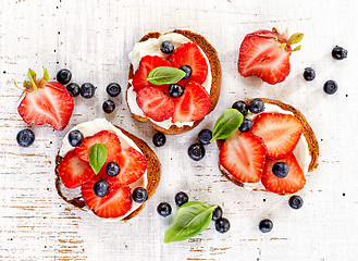 Image showing toasted bread with cream cheese and berries