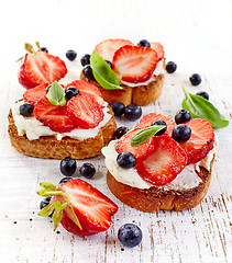 Image showing toasted bread with cream cheese and strawberries