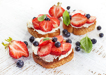 Image showing toasted bread with cream cheese and strawberries