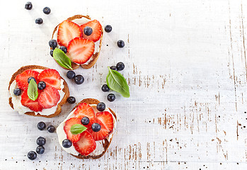 Image showing toasted bread with cream cheese and strawberries