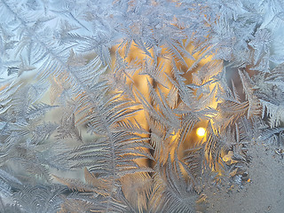 Image showing Ice pattern and sunlight on winter glass