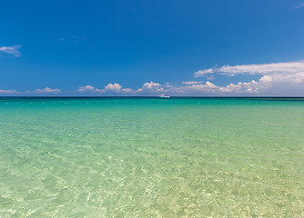 Image showing Beach on tropical island. Clear blue water and sky 