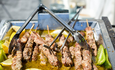 Image showing Juicy roasted kebabs on the metal tray