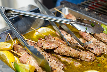 Image showing Juicy roasted kebabs on the metal tray